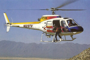 Bruce Haffner on helicopter skids